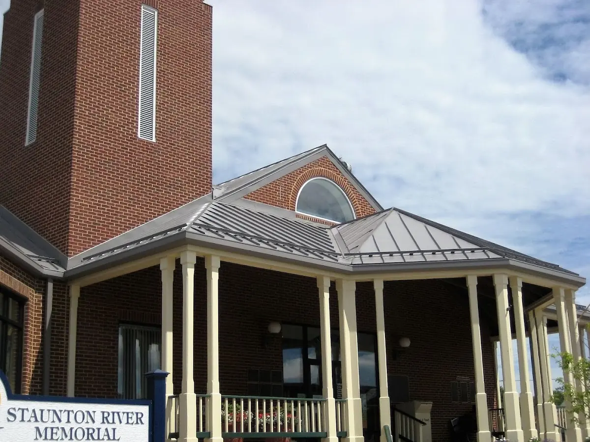 Skilled roofing craftsmen working on a residential roof in Old Dayton